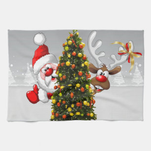 Jultomten och renar bakom julgran.j kökshandduk