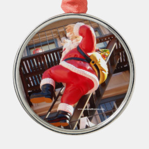 Jultomten på avfyraflykten julgransprydnad metall
