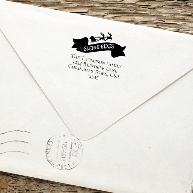 Jultomten Returadress jul Självfärgande Stämpel (Christmas santa and reindeer sleight rides return address self inking stamp.)