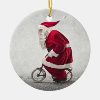 Jultomten rider en cykel julgransprydnad keramik