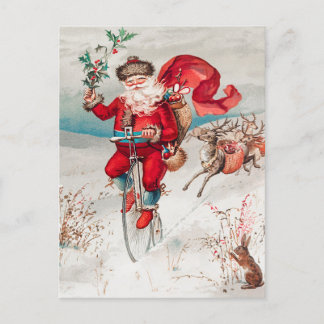 Jultomten Riding Bicycle, Reindeer and Rabbit Helg Vykort