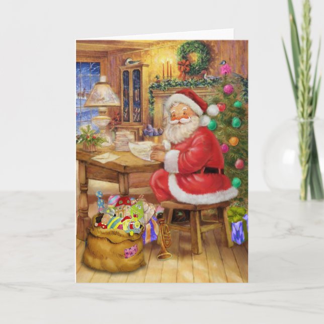 Jultomten som är funktionsduglig på hans skrivbord helgkort (Framsida)
