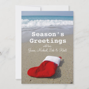 Jultomten strumpor på vacker strand julkort