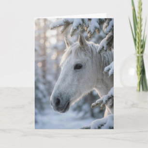 Julvit häst i snöig tall kort