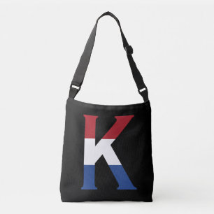 K Monogram överlagd på NLD-Flagga på bk-behållare Axelväska