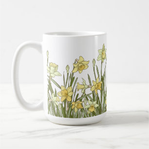 Kaffe mugg med blommigt gräns vid gult-dils