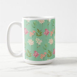 kaffe mugg med blommigt på gröntens bakgrund