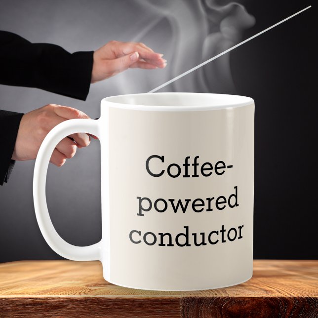 Kaffelstyrda musikers kaffemugg (A humorous mug especially for the 'Coffee-powered conductor', personalized with a name on the back)