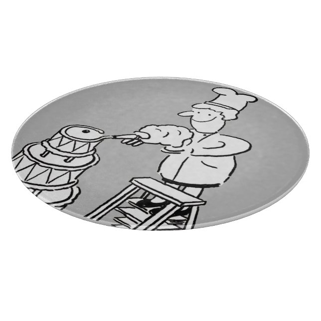 Kaksmakare som dekorerar en stor storlekskaka kumm (Hörn)