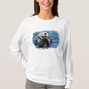 Kalifornisk havsutter (Enhydra lutris) putsar T-shirt