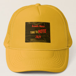 Kamala Harris trucker-hylsa. Gult färg. Keps