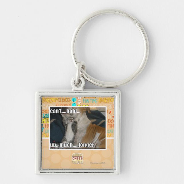 Kan inte rymma upp mycket Longer Fyrkantig Silverfärgad Nyckelring (Framsidan)