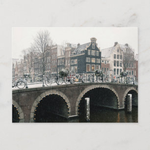 Kanal i Amsterdam på vykort för vintern