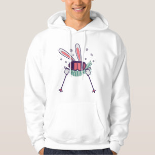Kanin på skidor med skidstavar skidglasögon och sc hoodie