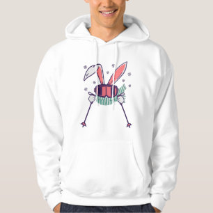Kanin på skidor med skidstavar skidglasögon och sc hoodie