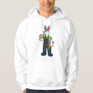 Kanin som jordbrukare med morot och hat hoodie