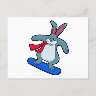 Kanin som snowboardåkare med snowboard och halsduk vykort