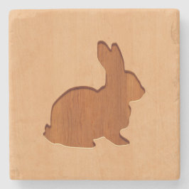Kaninsilhouette som inristas på den wood designen stenunderlägg