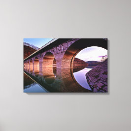 Kanvastrycket Solnedtonat för Bridge Arches Sunse Canvastryck