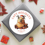 Kapacitet Helgdagar Cute Roligt Capybara God jul Runt Klistermärke<br><div class="desc">Lägg till lite roligt i dina presenter med dessa "Kapy Helgdagars"-klistermärken! Med en söt kapybara i en julhatt med renar,  omgiven av gåvor,  tillför den här anpassningsbar familjen namn en lekfull,  festlig beröring till presenter!</div>