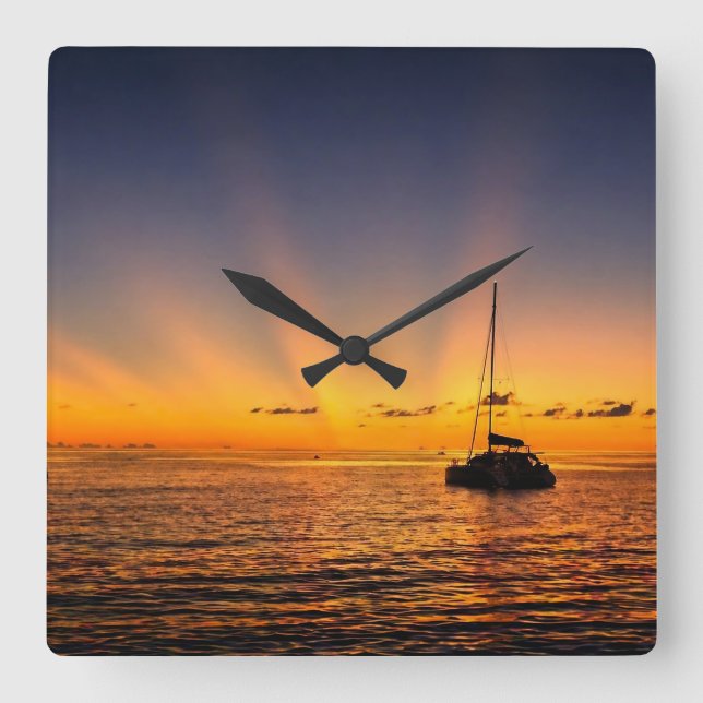 Karibisk solnedgång segelbåt väggklocka (Framsida)