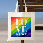 Kärlek är Pridet kärlek Tygkasse<br><div class="desc">Det här Pridet Tote Bag är dekorerat med KÄRLEK IS KÄRLEK i fetstil,  vitt brev på en vattenfärgad regnbågsbakgrund med rött,  orange,  gult,  grönt,  blått och lila. Ursprunglig vattenfärg © Michele Davies.</div>