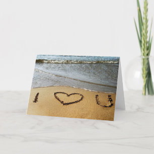 Kärlek på strandhälsningkortet kort
