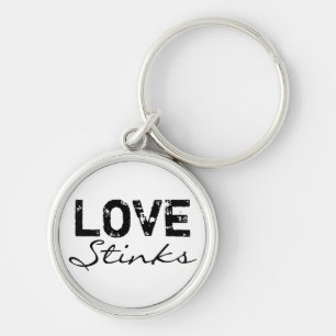 Kärlek stinker Keychain Rund Silverfärgad Nyckelring