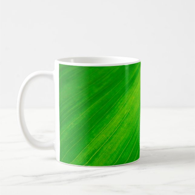 Kärnventiler i löv vid grönten löv kaffemugg (Vänster)