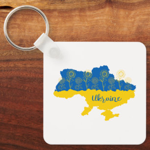 Karta i Ukraina med solros och ukrainsk flagga Nyckelring