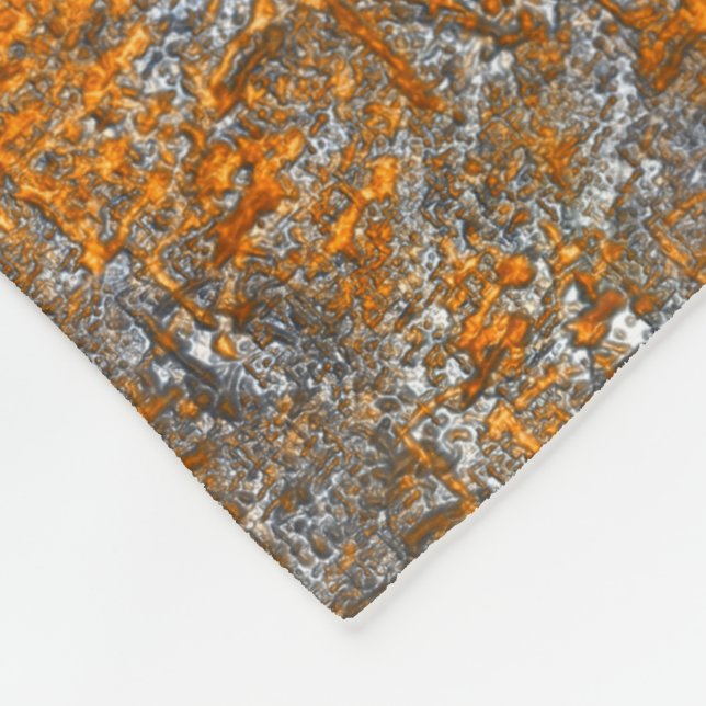 Kastad med gyllene orangar över vitaktigt grått rå fleecefilt (Hörn)