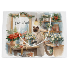 Katt arrangerar vinterblommor för jul