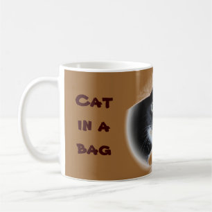 Katt i en hänga lös kaffemugg