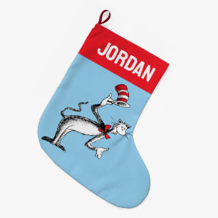 Katt i hatten tar en bow stor julstrumpa