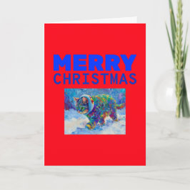 Katt i snö med öronmuffar helgkort