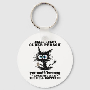 Katt inuti varje äldre person är en yngre person nyckelring