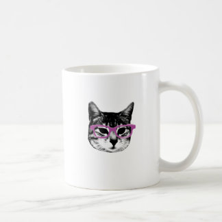 Katt med exponeringsglas kaffemugg