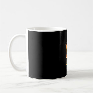 Katt med klammerparentes kaffemugg