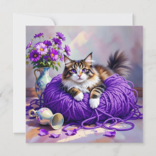 Katt med lila ögon i lila garn och blommor