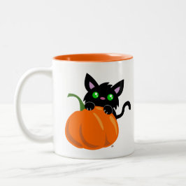 Katt och en Pumpkin Coffee Mugg