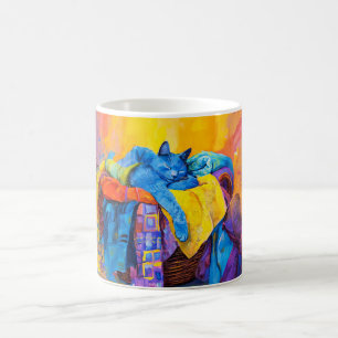Katt som sover i tvättberg kaffemugg