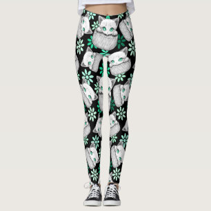 Katt Söt och Lekfull tittar ut från en Ficka Leggings
