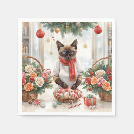 Katten arrangerar julblommor pappersservett