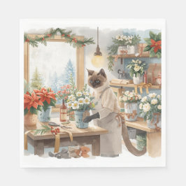 Katten arrangerar julblommor pappersservett