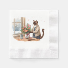 Katten arrangerar julblommor pappersservett