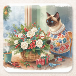 Katten arrangerar julblommor underlägg papper kvadrat
