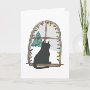 Katten tittar ut ett fönster helgkort