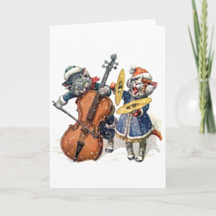 Katter som leker julmusik i snön helgkort