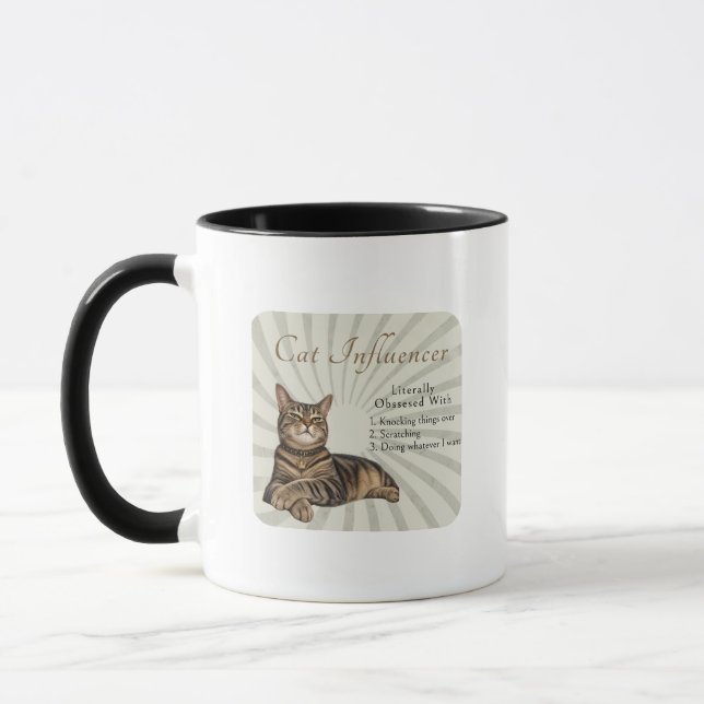 Kattinfluencer bokstavligen besatt mugg (Vänster)