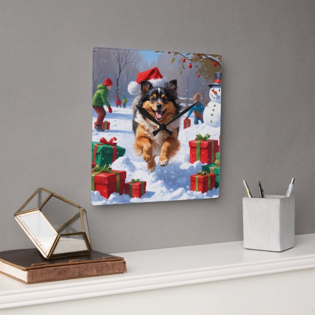 Keeshond-hund springer i snö med julhatt fyrkantig klocka (Kontor)